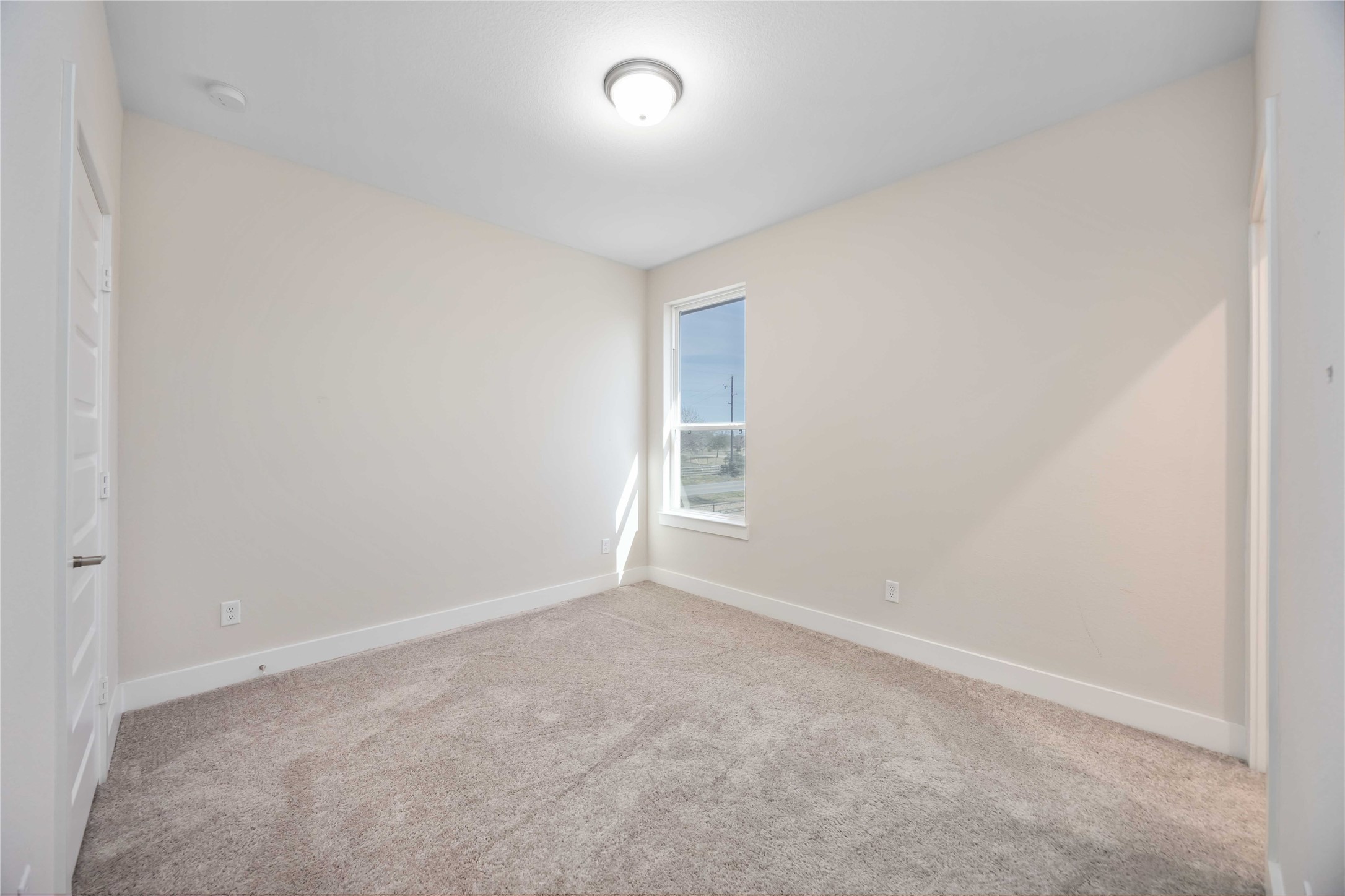 32022 Western Grv Lane Fulshear, TX 77441 - Photo 35 of 49 a view of an empty room and a window
