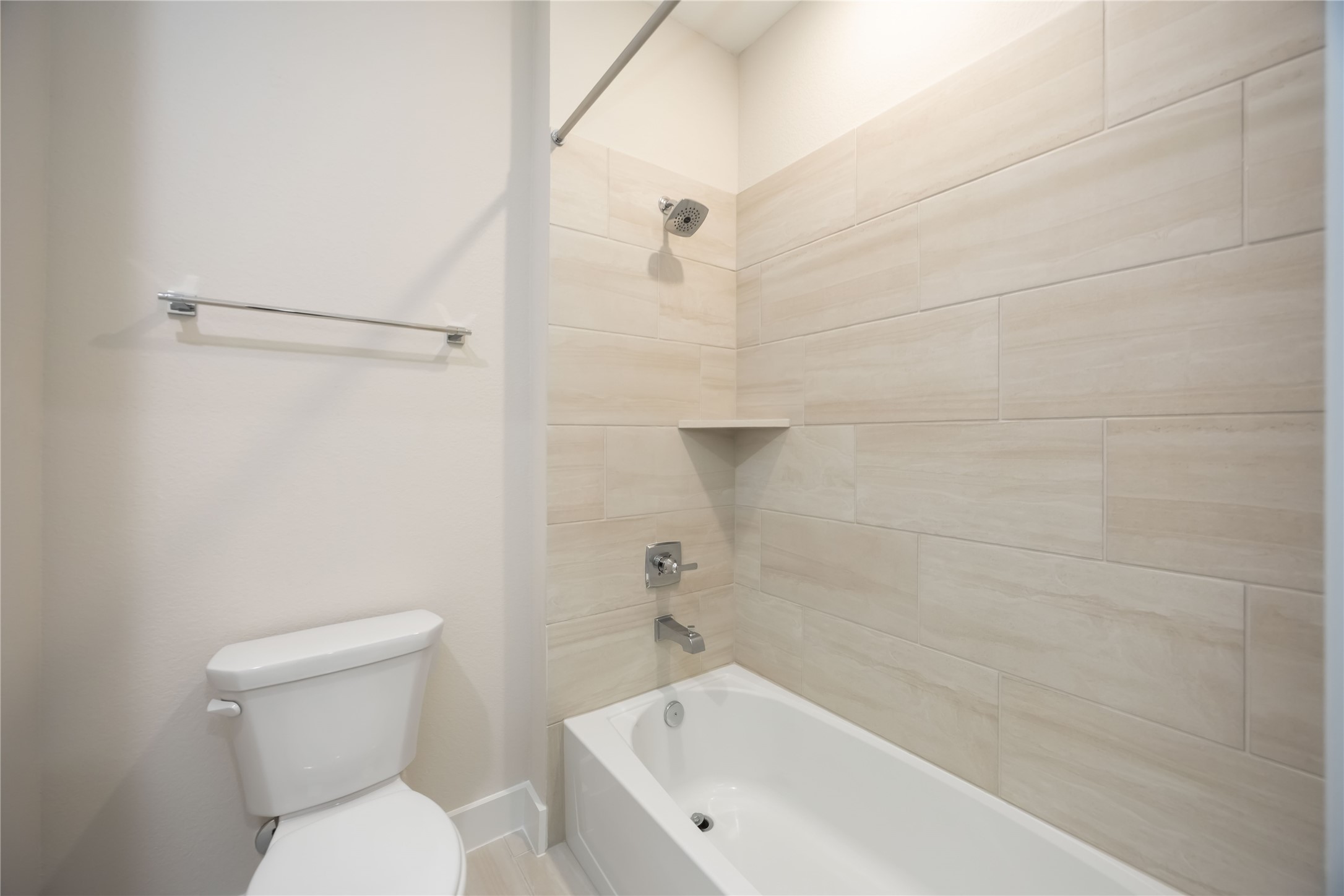 32022 Western Grv Lane Fulshear, TX 77441 - Photo 38 of 49 a white bath tub sitting next to a toilet