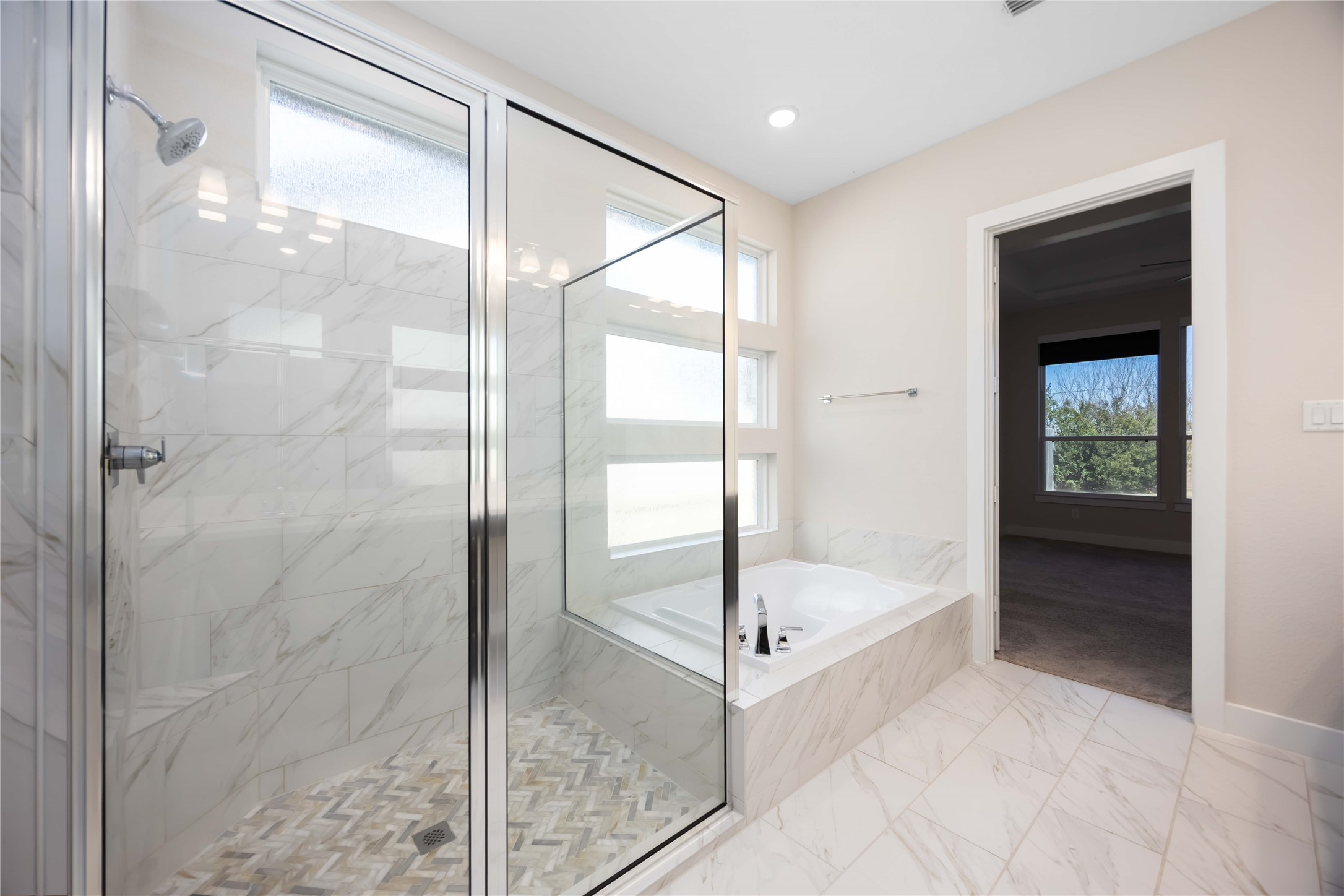 32022 Western Grv Lane Fulshear, TX 77441 - Photo 45 of 49 a bathroom with a glass shower door and a sink