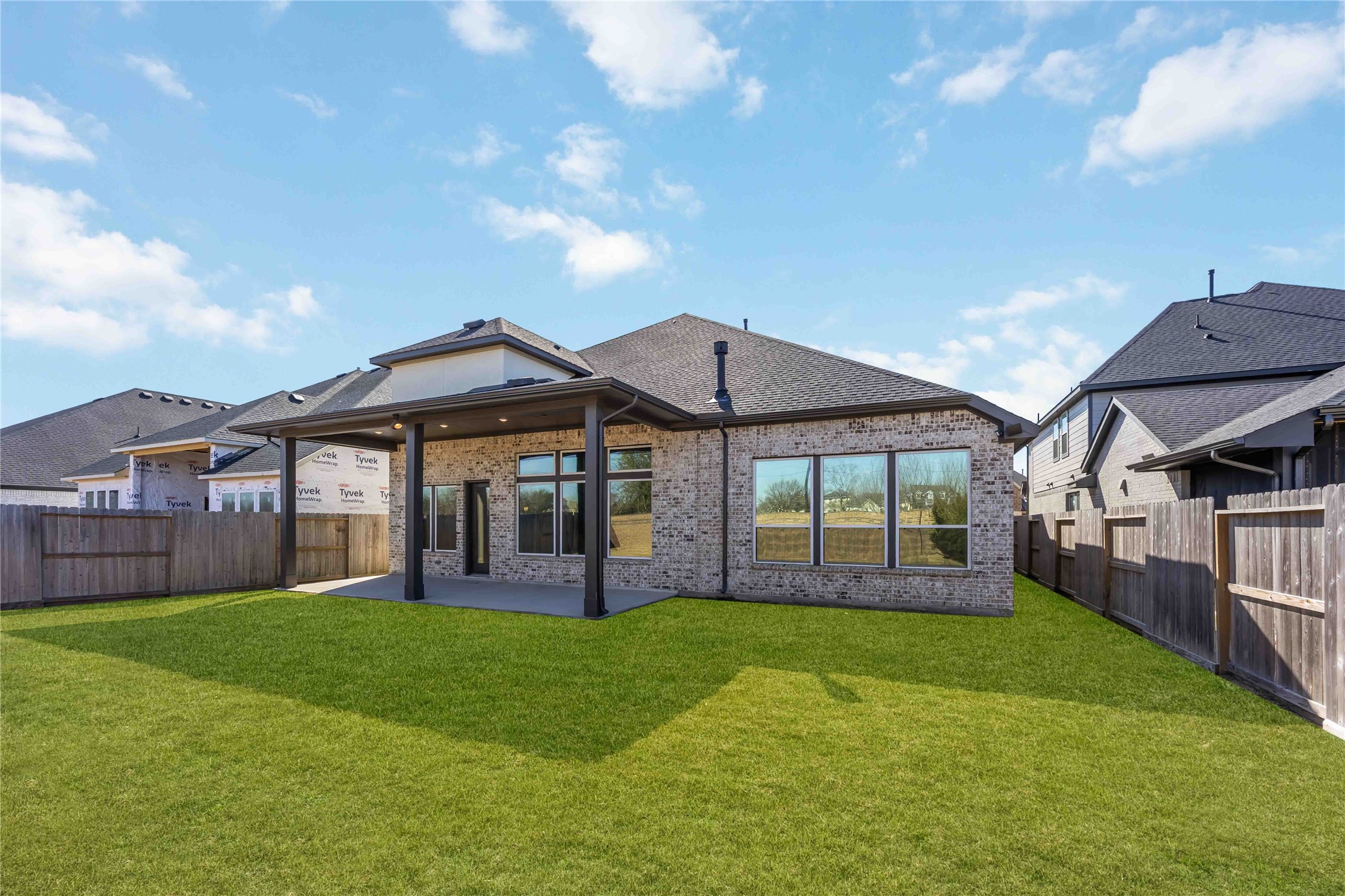 32022 Western Grv Lane Fulshear, TX 77441 - Photo 47 of 49 a front view of a house with a yard and porch