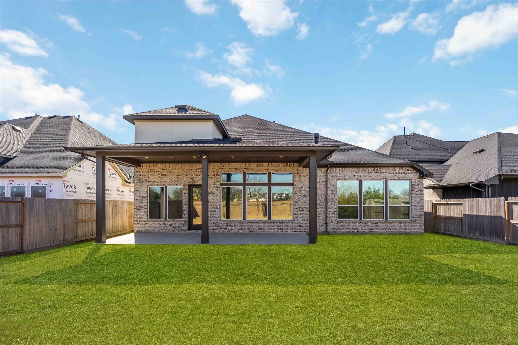 32022 Western Grv Lane Fulshear, TX 77441 - Photo 48 of 49 a front view of a house with garden