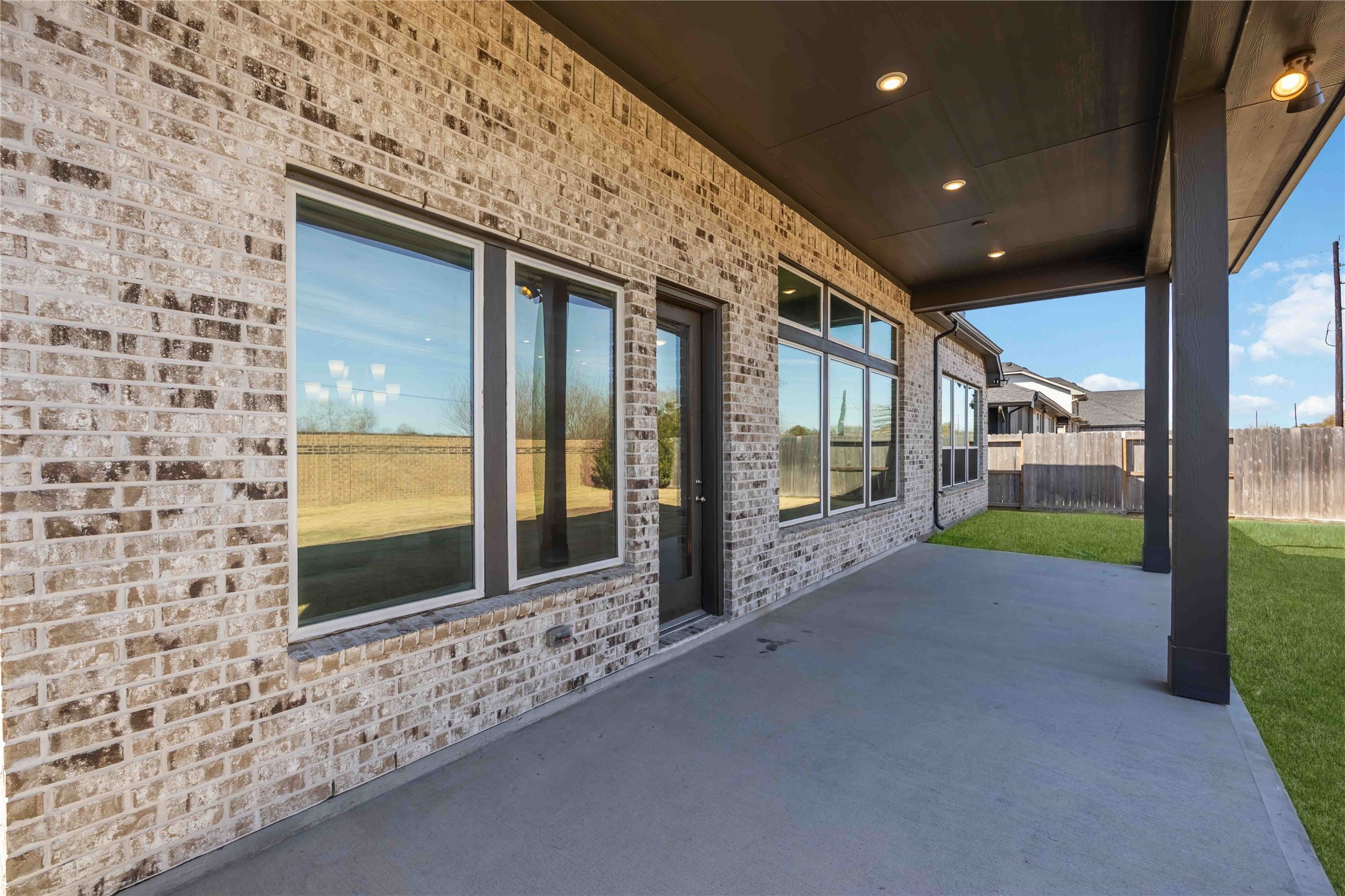 32022 Western Grv Lane Fulshear, TX 77441 - Photo 49 of 49 a view of a brick house with a large window