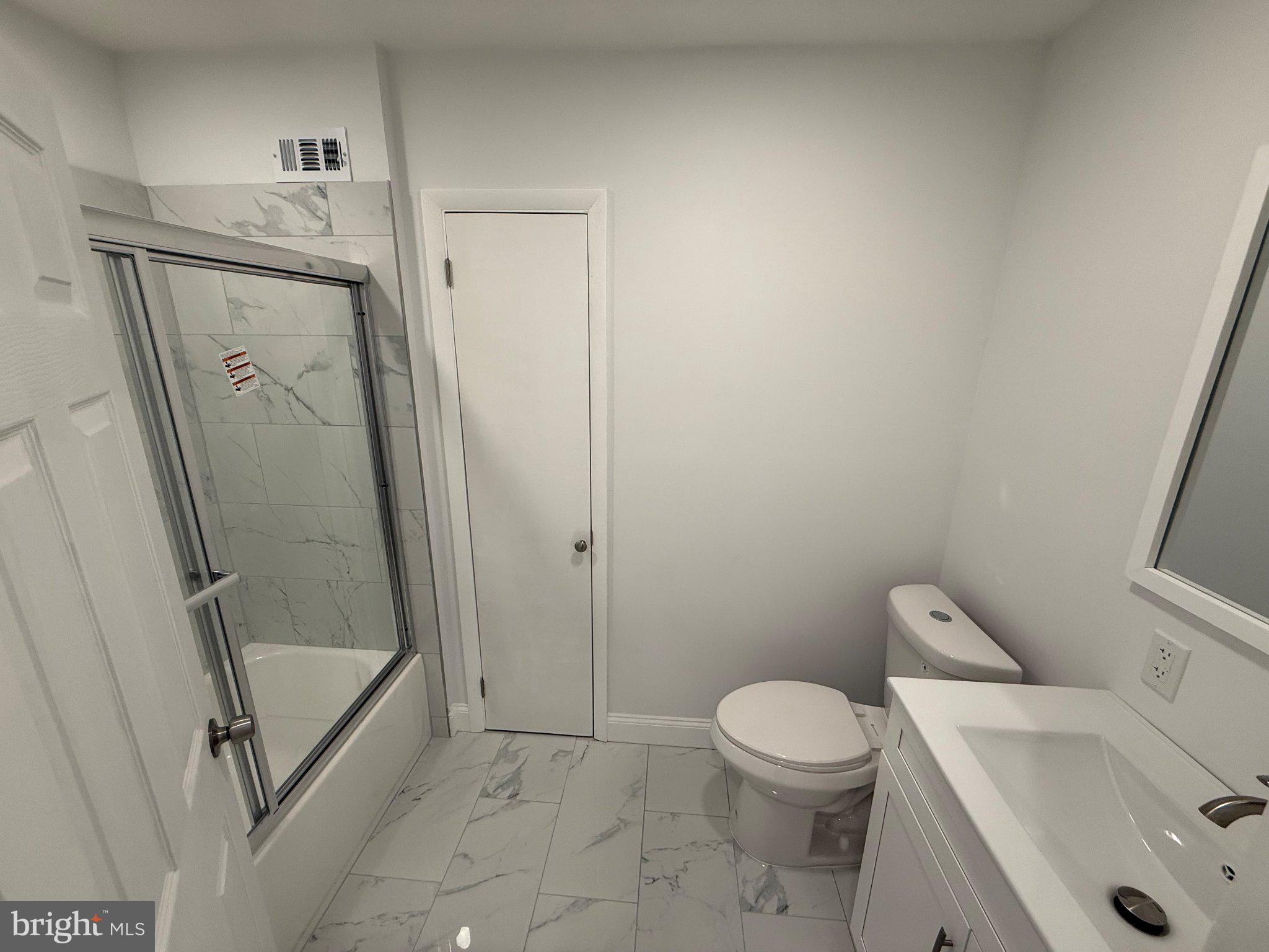 1104 Church Road Wyncote, PA 19095 - Photo 19 of 31 a bathroom with a toilet and a shower