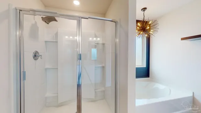 a bathroom with a bathtub and a shower