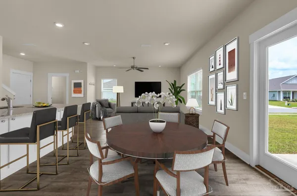 a view of a dining room with furniture and window