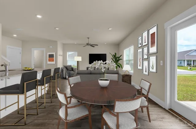 a view of a dining room with furniture and window