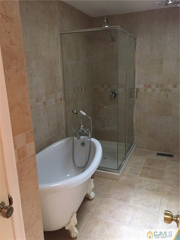 3401 Springbrook Drive Edison, NJ 08820 - Photo 15 of 21 a bathroom with a sink and shower