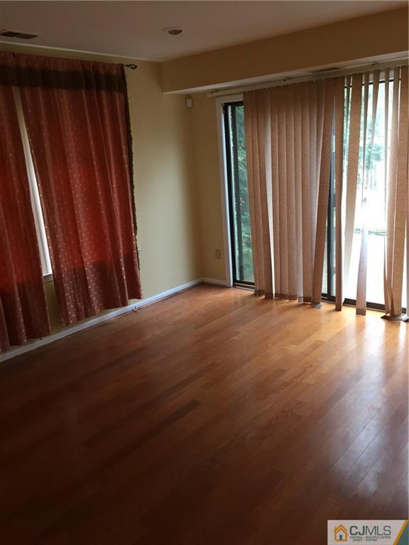 3401 Springbrook Drive Edison, NJ 08820 - Photo 18 of 21 a view of a room with wooden walls and floor