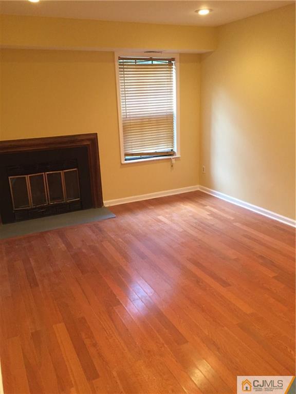 3401 Springbrook Drive Edison, NJ 08820 - Photo 19 of 21 an empty room with wooden floor and windows