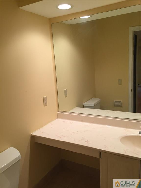 3401 Springbrook Drive Edison, NJ 08820 - Photo 20 of 21 a bathroom with a sink and a vanity