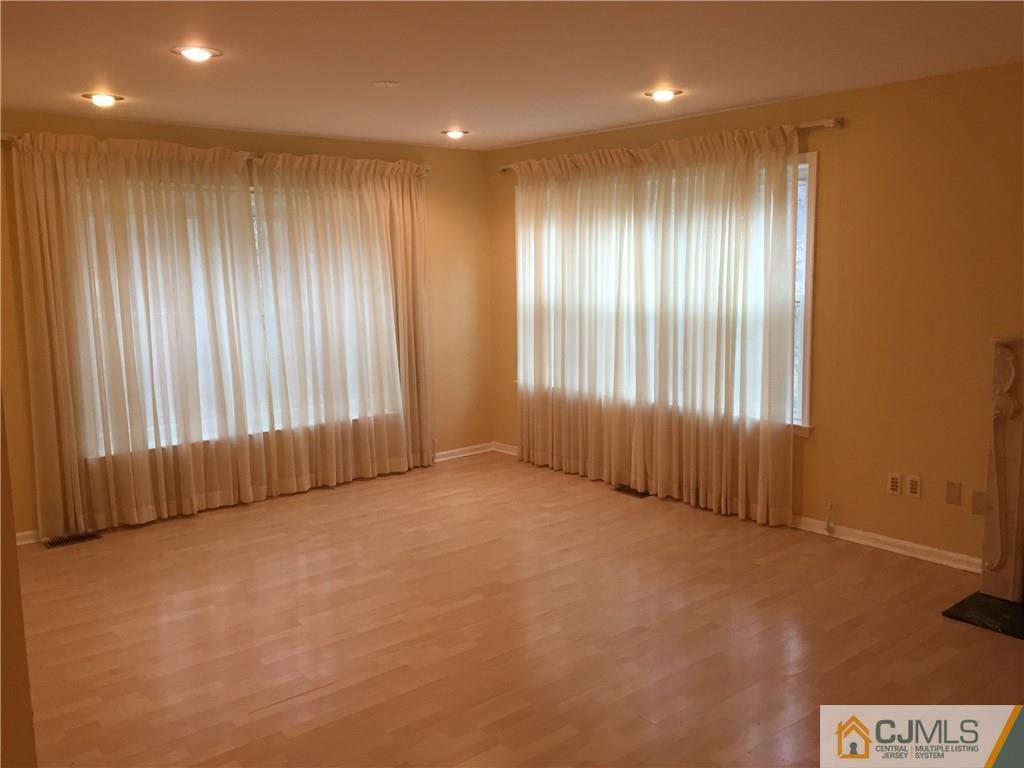 3401 Springbrook Drive Edison, NJ 08820 - Photo 3 of 21 an empty room with windows
