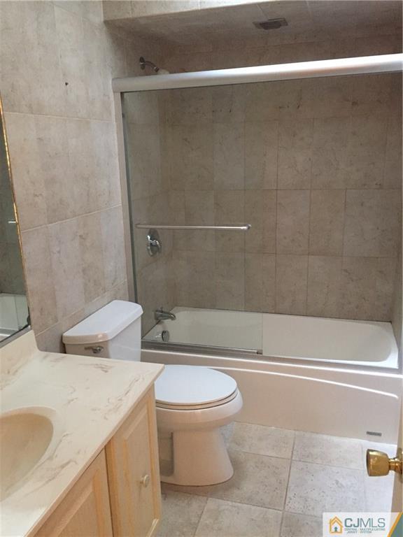 3401 Springbrook Drive Edison, NJ 08820 - Photo 10 of 21 a bathroom with a sink a toilet and shower