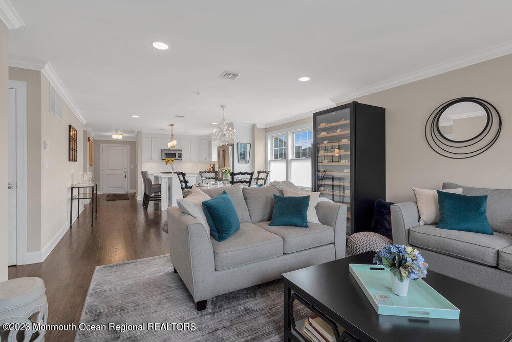 308 Morris Avenue, Unit A Spring Lake, NJ 07762 - Photo 14 of 37 a living room with furniture and a table