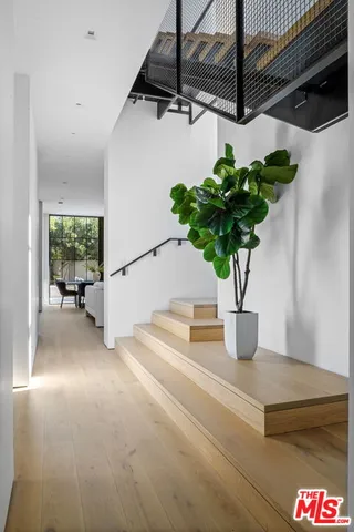 a vase of flowers sitting on a floor