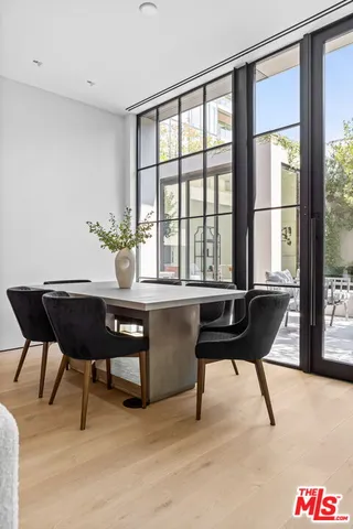 a workspace with furniture window and a wooden floor