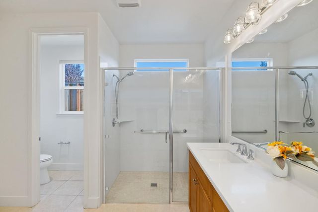 a view of a house with backyard and porch