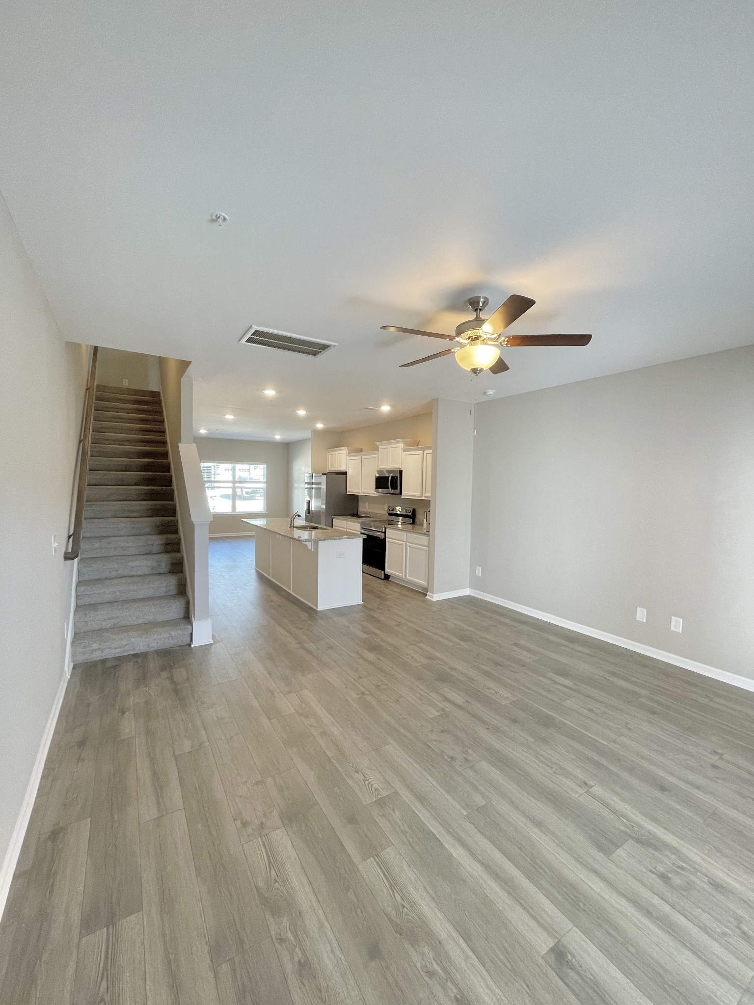 123 Addi Street Pleasant View, TN 37146 - Photo 6 of 13 a view of kitchen and hall with wooden floor