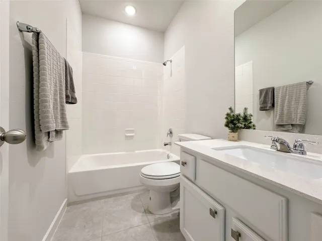 a bathroom with a sink a toilet and a bathtub