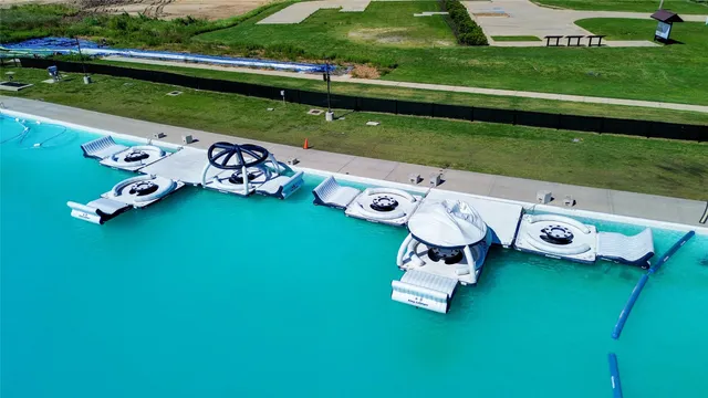 an aerial view of a golf course with chairs