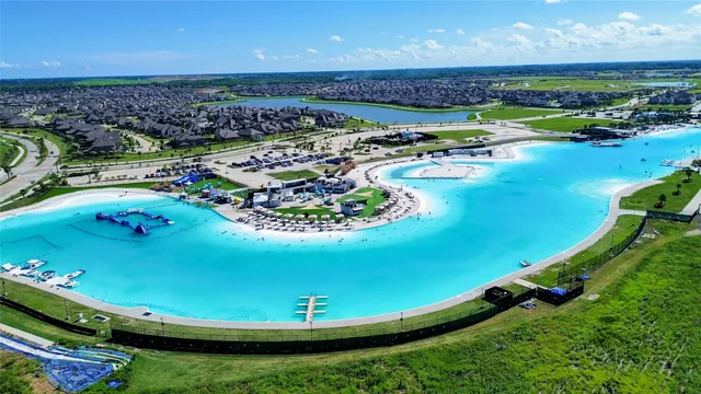 a view of a swimming pool with a yard