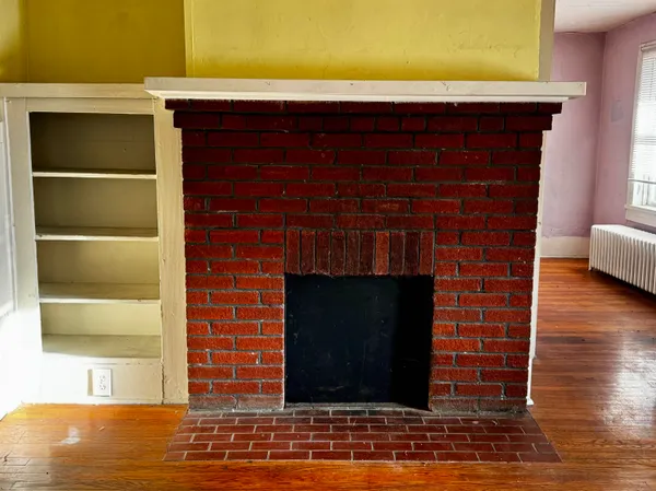 a living room with a fireplace