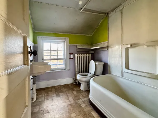 a bathroom with a tub and a shower