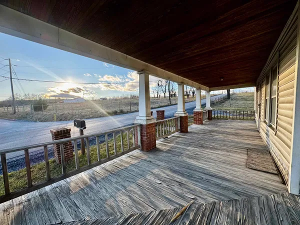 a view of a balcony with wooden floor