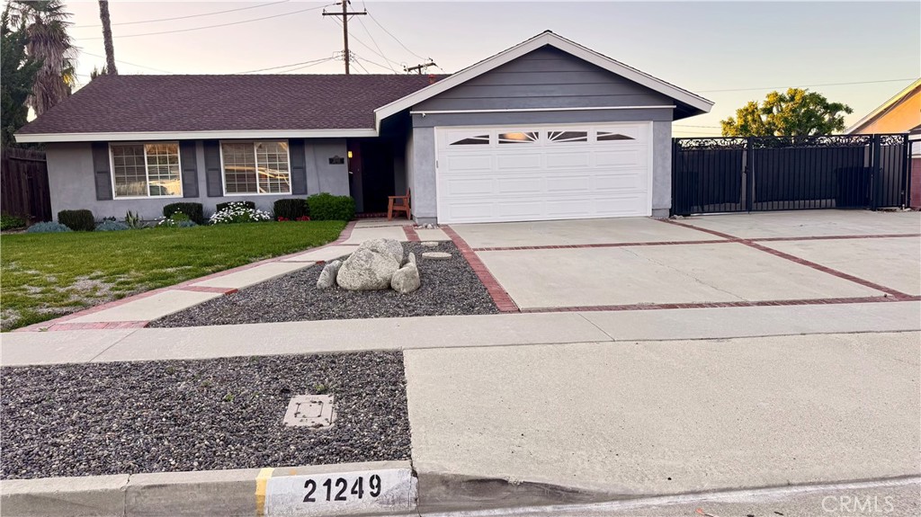 21249 Davan Street Diamond Bar, CA 91789 - Photo 1 of 1 a front view of a house with a yard and garage