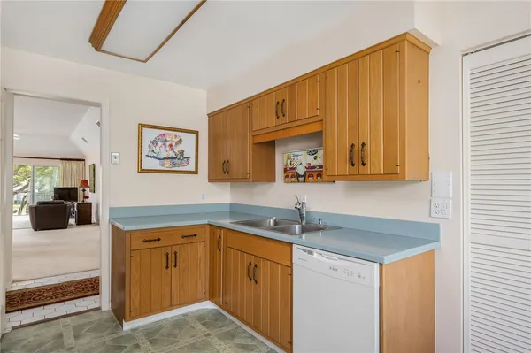a kitchen with a sink and cabinets