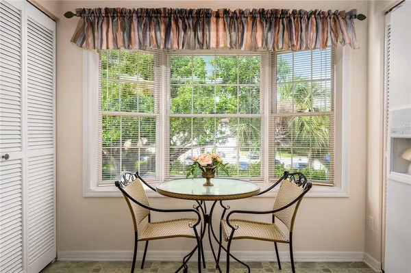 a dining room with furniture and window