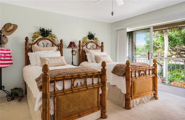 a bedroom with two beds and a window