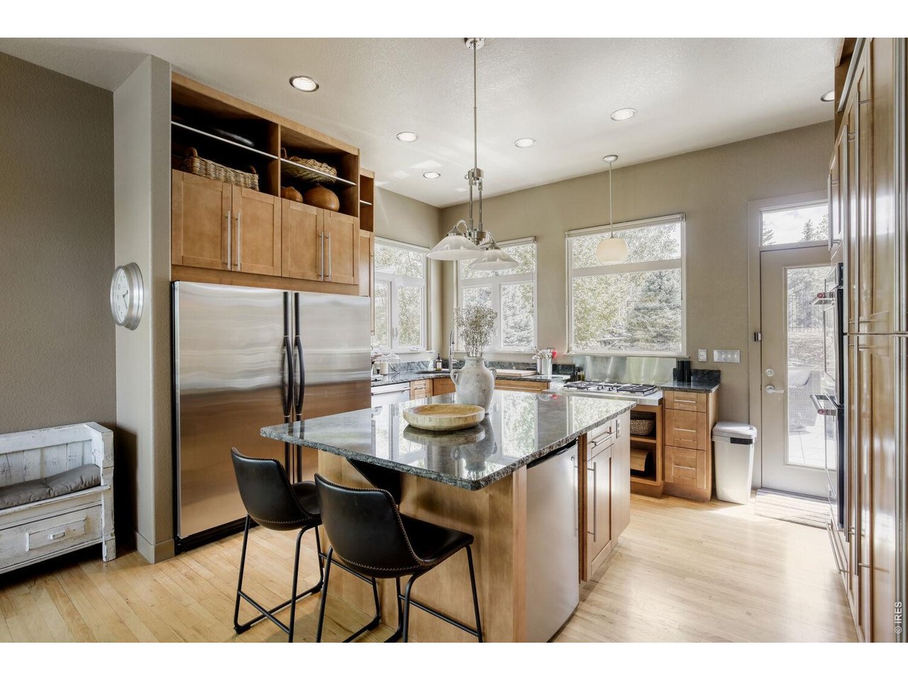 7550 Vardon Way Fort Collins, CO 80528 - Photo 13 of 29 a kitchen with stainless steel appliances granite countertop a sink a stove and a refrigerator