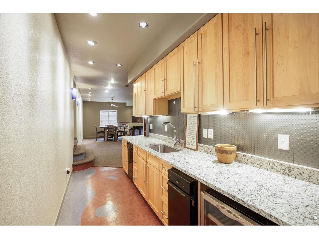 7550 Vardon Way Fort Collins, CO 80528 - Photo 23 of 29 a kitchen with a sink dishwasher stove and cabinets