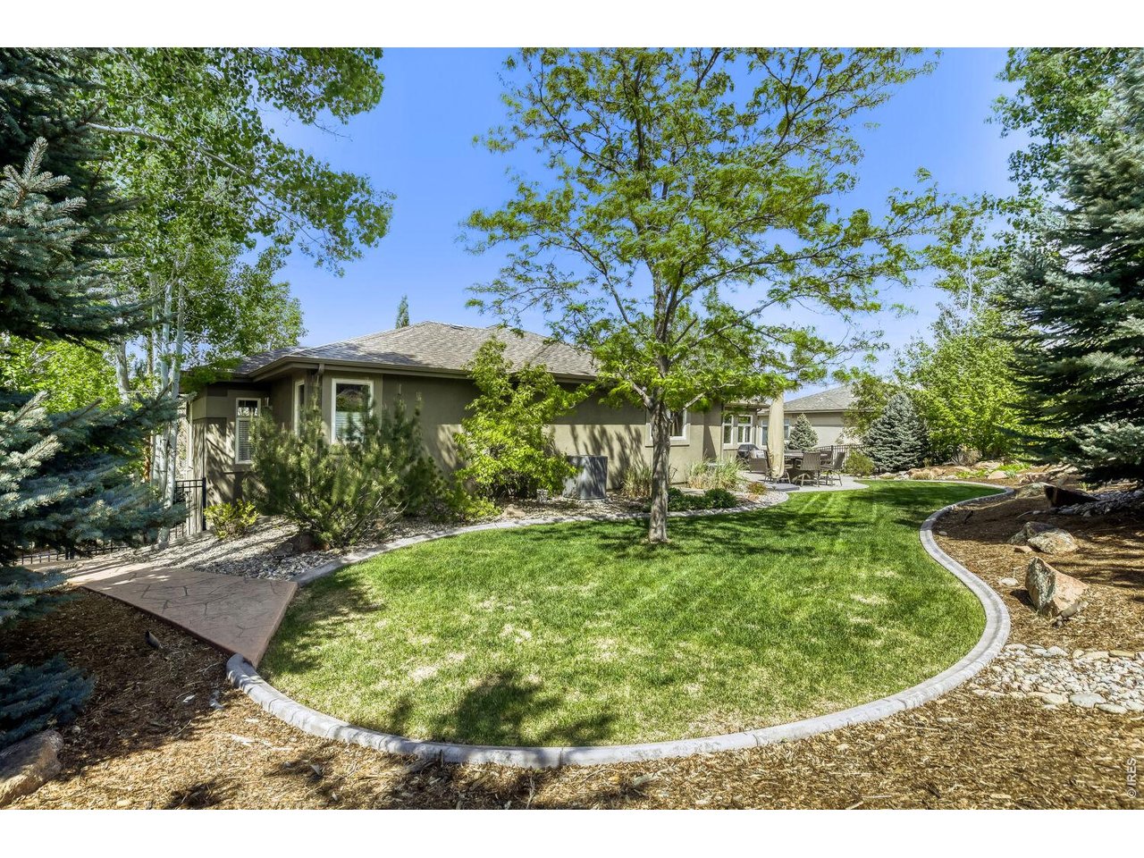 7550 Vardon Way Fort Collins, CO 80528 - Photo 9 of 29 a view of a backyard with a fountain