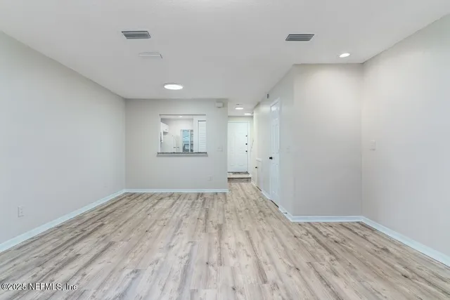 a kitchen with wooden cabinets and a stove top oven