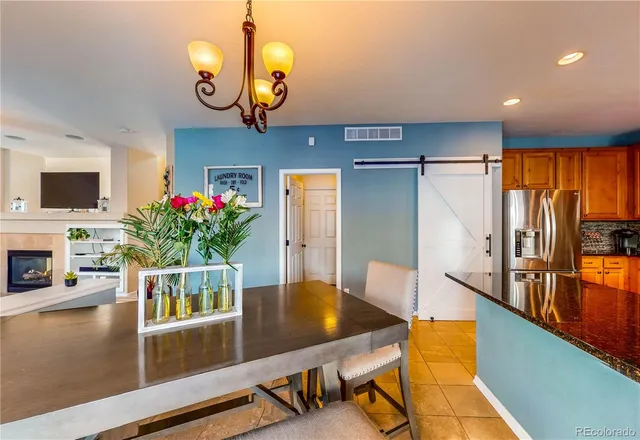 a kitchen with stainless steel appliances granite countertop sink stove refrigerator granite counter tops and a window