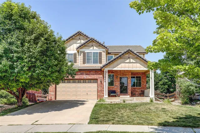 a view of a porch with chairs and backyard