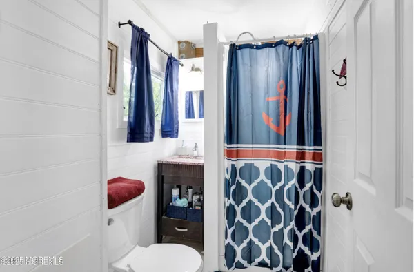 a bathroom with a shower curtain