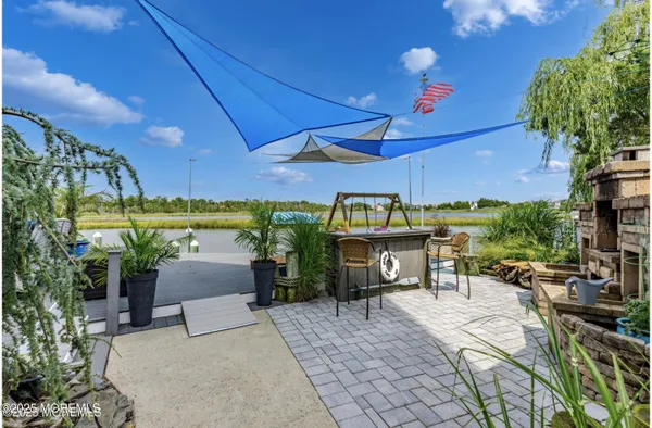 a view of a chairs and table in the patio