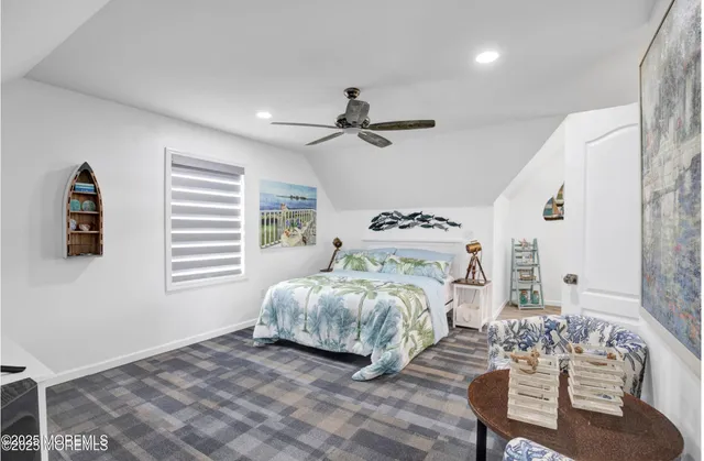 a bedroom with bed and a window