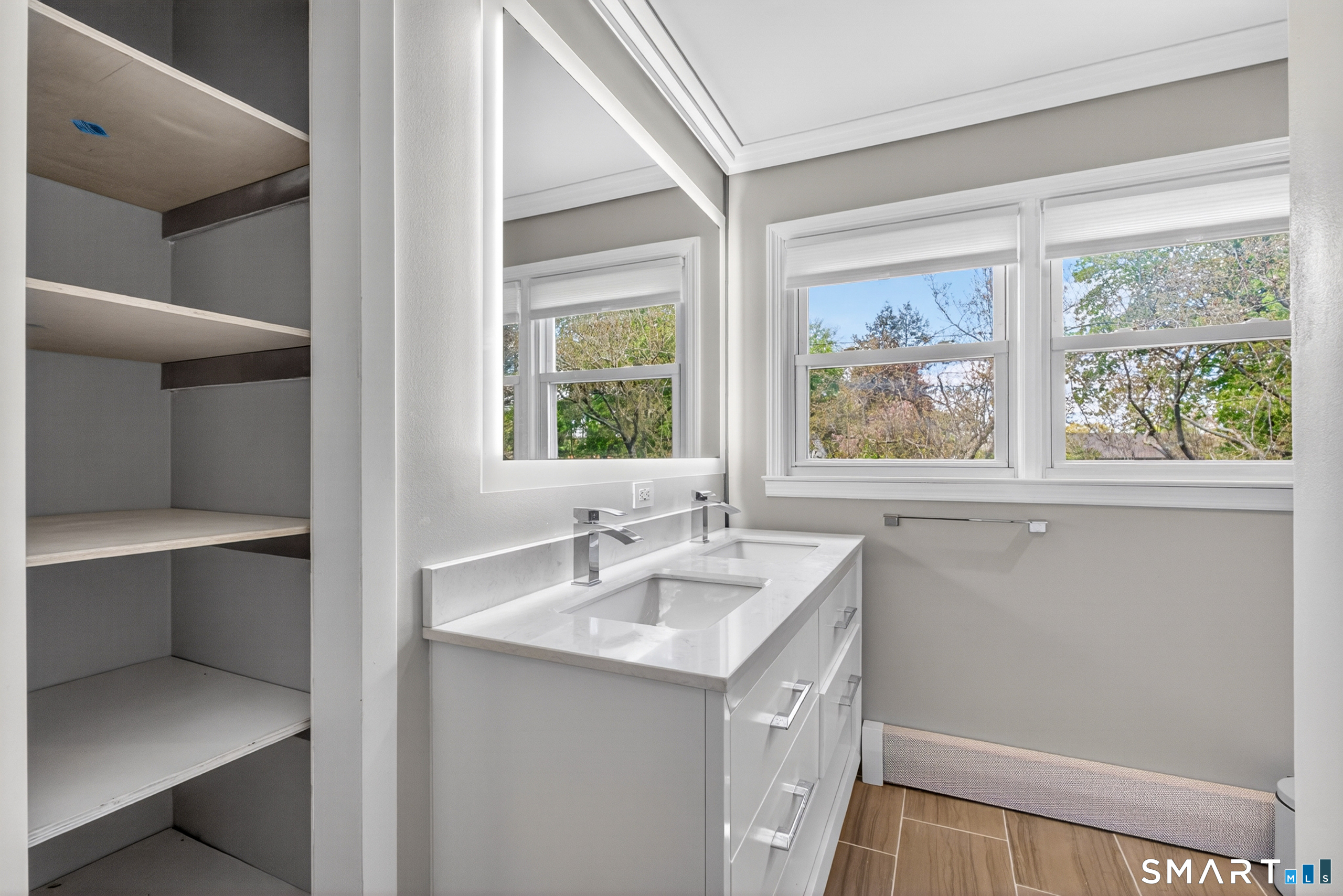 568 Wiese Road Cheshire, CT 06410 - Photo 27 of 40 a bathroom with a sink and a mirror