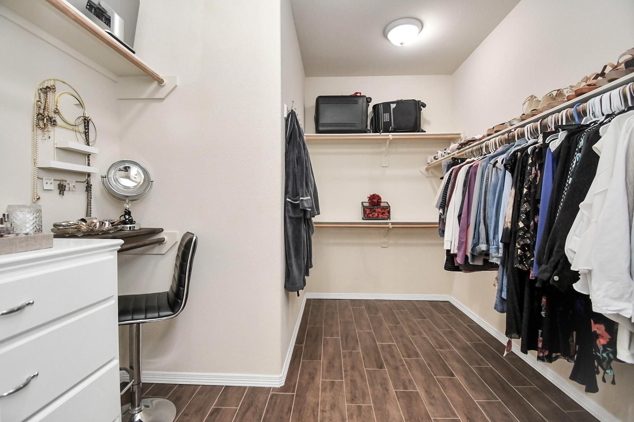 8624 Sunset Loch Drive Spring, TX 77379 - Photo 25 of 44 a view of walk in closet with clothes and shoes