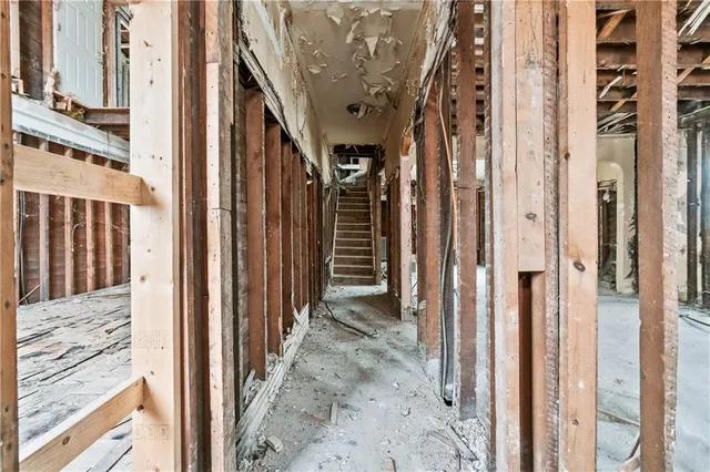 a view of a porch with a table and chairs