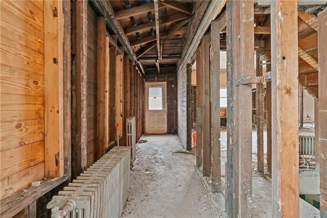 a view of an empty room with wooden frame