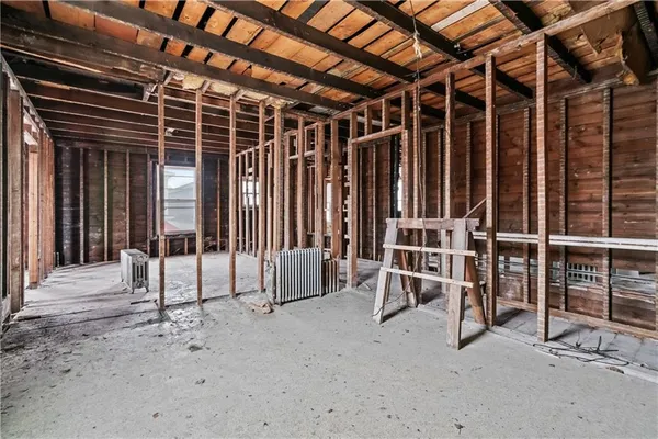 a view of a house with a floor to ceiling window and wooden floor
