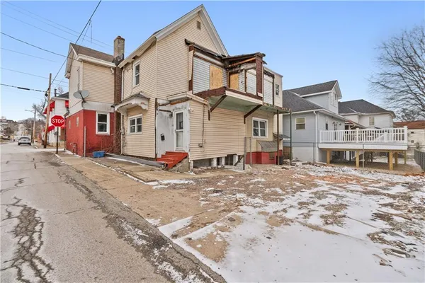 a car parked in front of a house