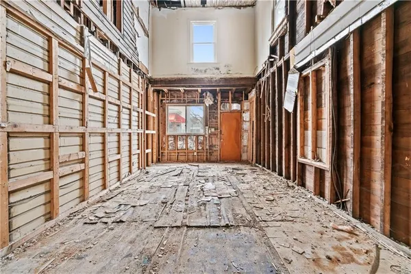 a view of a room with wooden walls