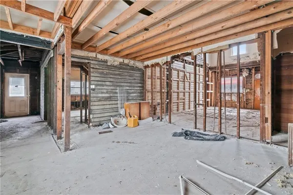 a view of an empty room with stairs