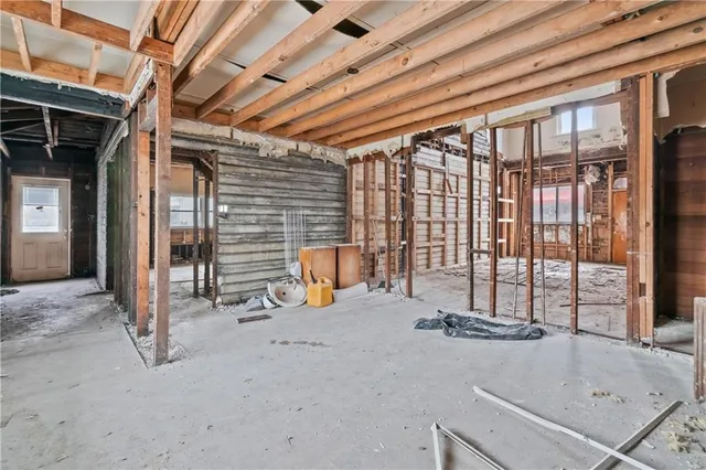 a view of an empty room with stairs