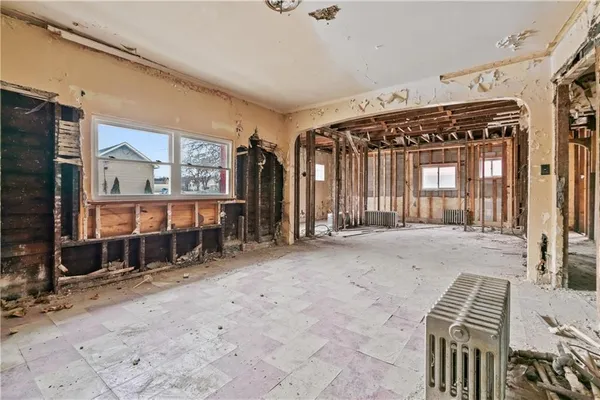 a view of staircase with railing and a rug